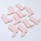 15mm strawberry milkshake pink acrylic boot stud earring blanks laid flat with a white background.