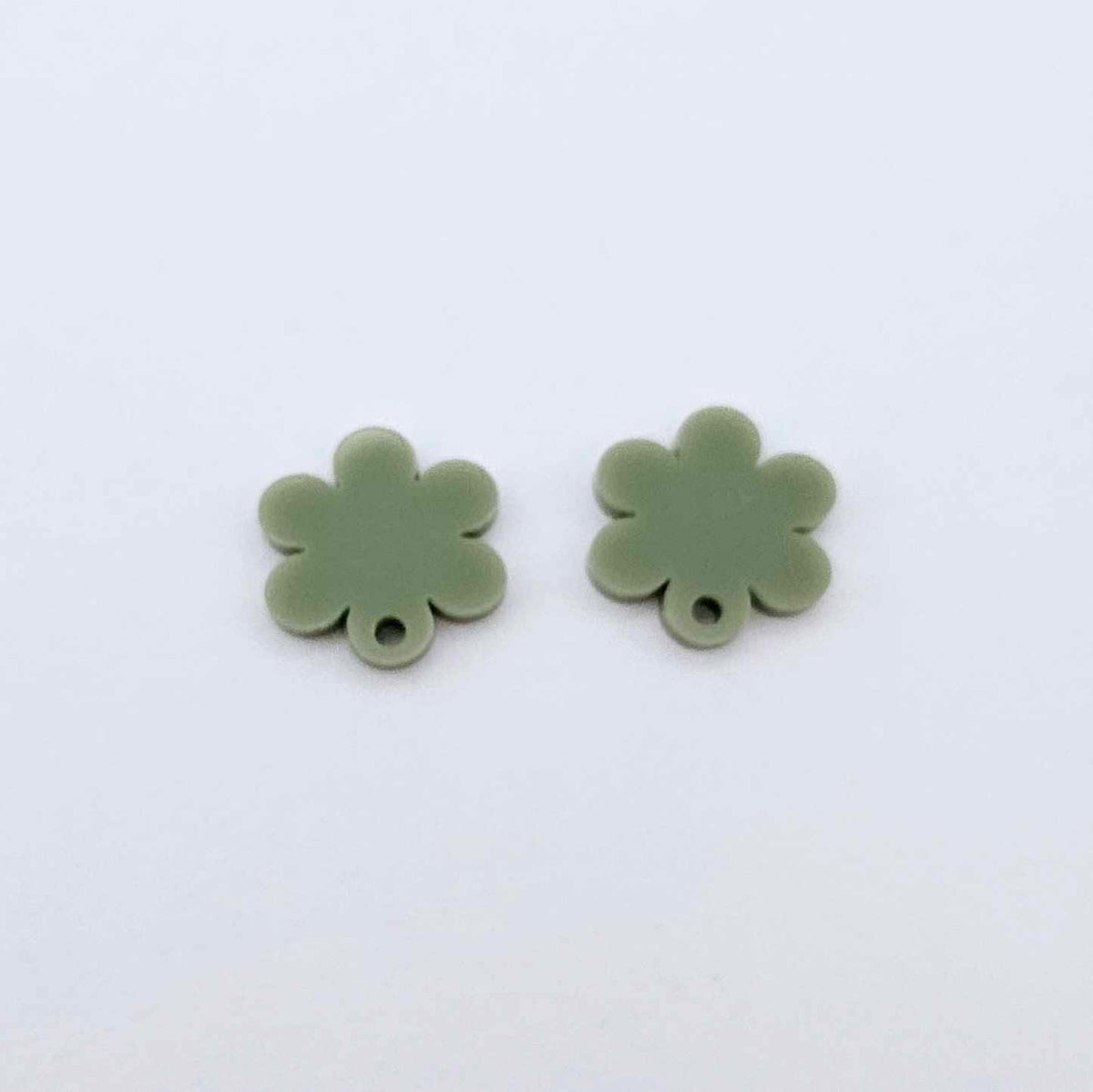 One pair of 14mm olive green acrylic flower earring topper blanks laying flat.