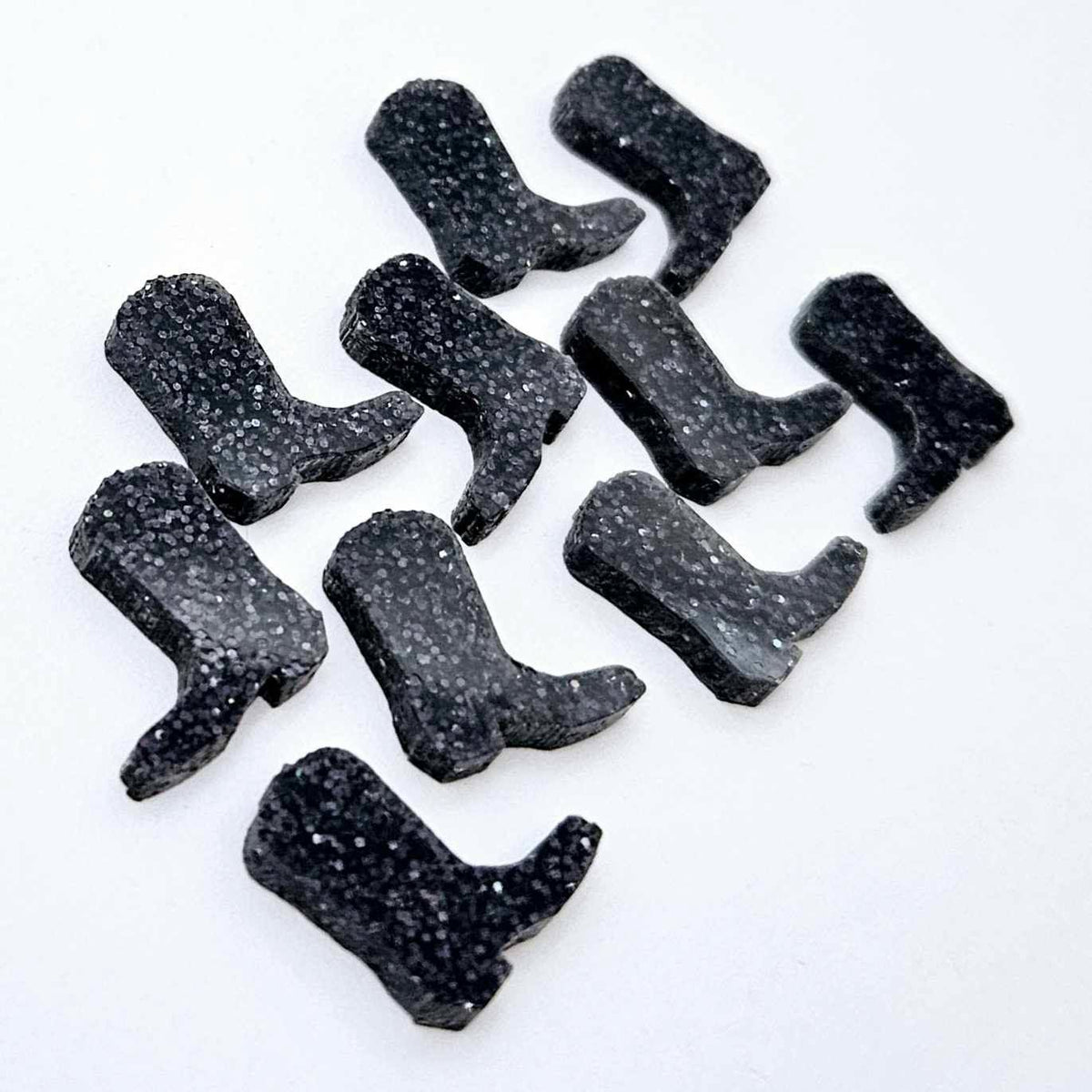 15mm holographic black glitter boot stud earring blanks laid flat together.