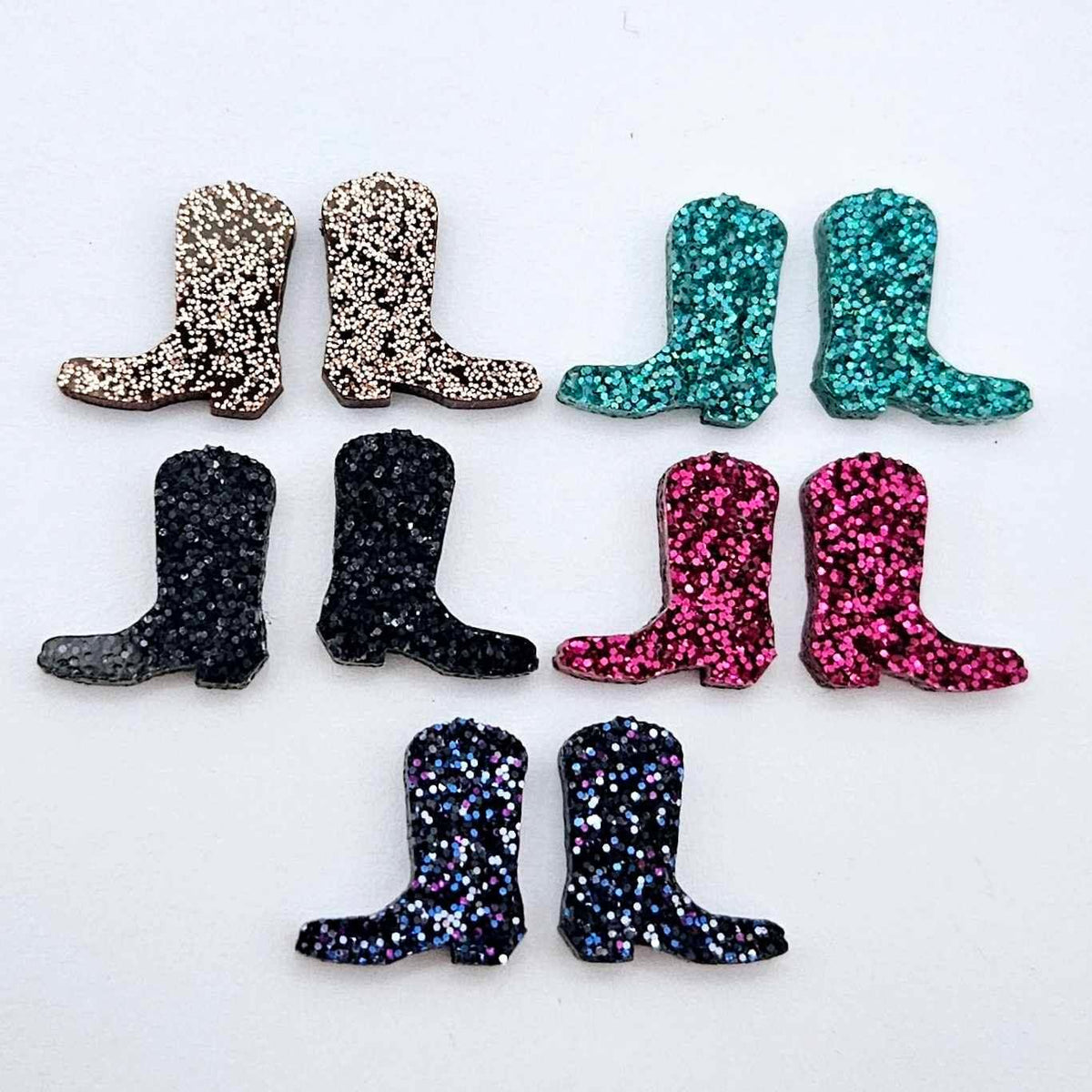 15mm glitter boot stud earring blanks in copper, black, holographic blue, hot pink and teal glitter, with one pair of each colour laid flat together.