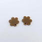 One pair of 14mm iced coffee acrylic flower earring topper blanks laying flat.