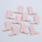 15mm strawberry milkshake pink acrylic boot stud earring blanks laid flat with a white background.