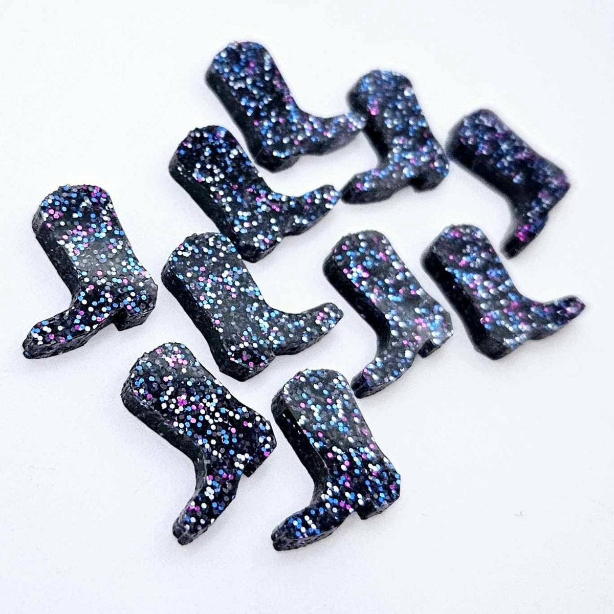 15mm holographic blue glitter boot stud earring blanks laid flat together.