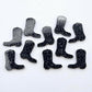 15mm holographic black glitter boot stud earring blanks laid flat together.
