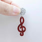 40mm red glitter treble clef earring dangle blank assembled with a 14mm silver glitter topper, showing how the pieces can be paired to create a finished music-inspired earring.