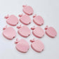14mm pastel pink acrylic apple earring stud blanks laid flat together.