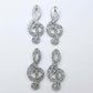 40mm silver glitter acrylic treble clef earring dangle blanks laid flat together.
