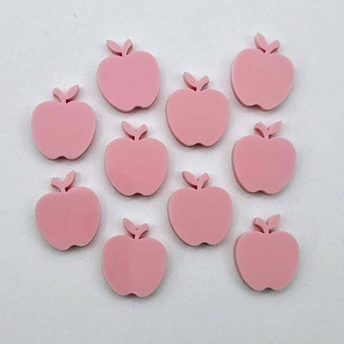14mm pastel pink acrylic apple earring stud blanks laid flat together.