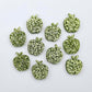 14mm light green glitter acrylic apple earring stud blanks laid flat together.