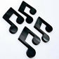 Two pairs of 35mm black marble acrylic music note earring dangle blanks laid flat together.
