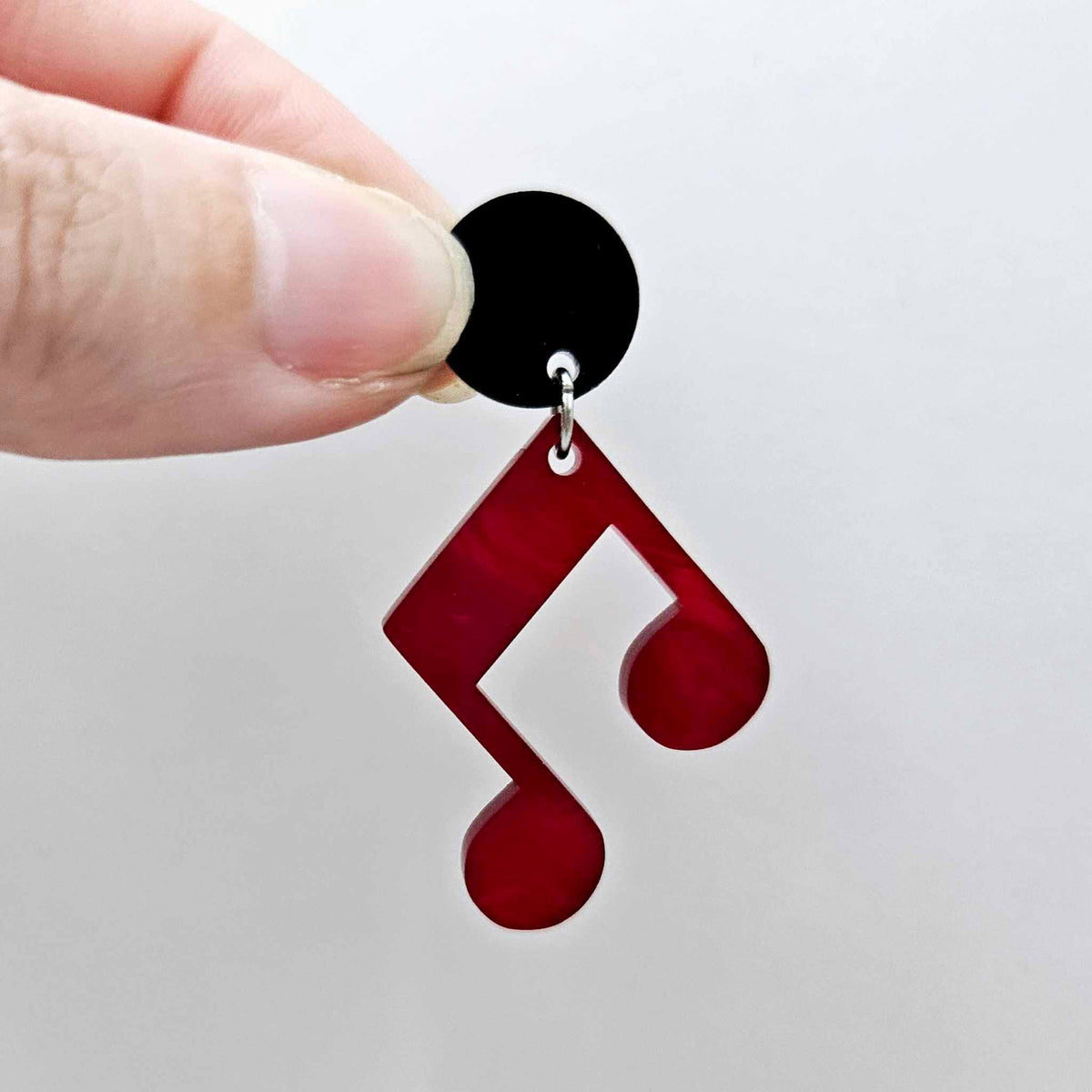 35mm red marble acrylic music note earring dangle blank assembled with a 14mm black topper, showing the lightweight finished earring design.