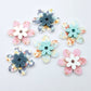 UV printed acrylic flower earring blanks in Cherry Blossom and White, Floral Bloom and Pastel Aqua, and Hawaii Dream and Bluestone, featuring two-piece floral designs made for 20mm hoop earrings.