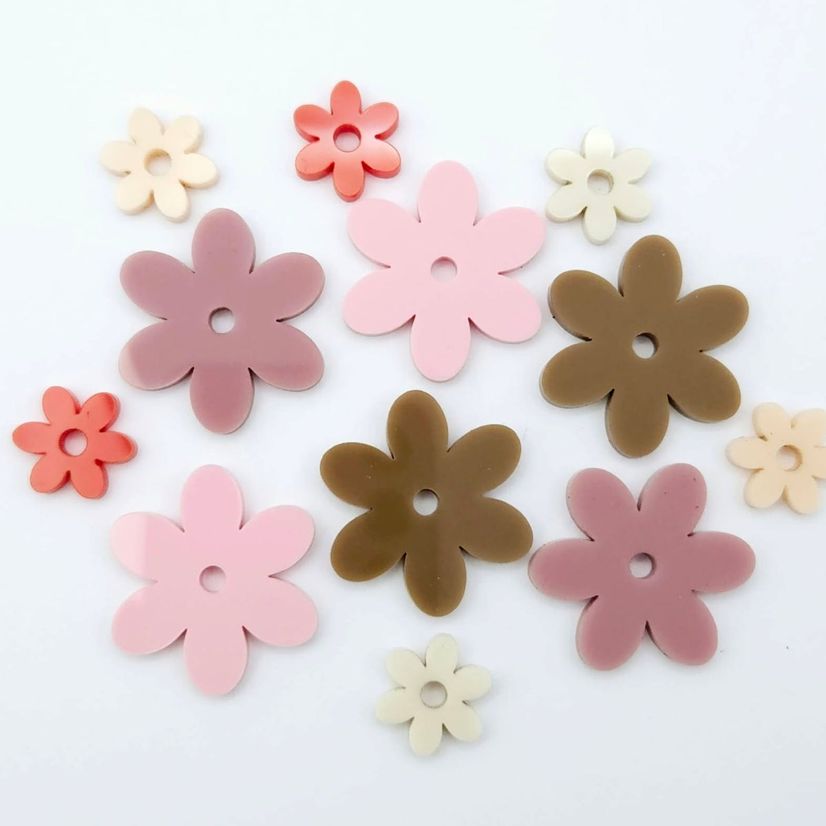 Two-piece solid acrylic flower earring blanks in Pastel Pink and Red, Dusty Rose and Peach, and Iced Coffee and Cream, laid flat together and designed for 20mm hoop earrings.