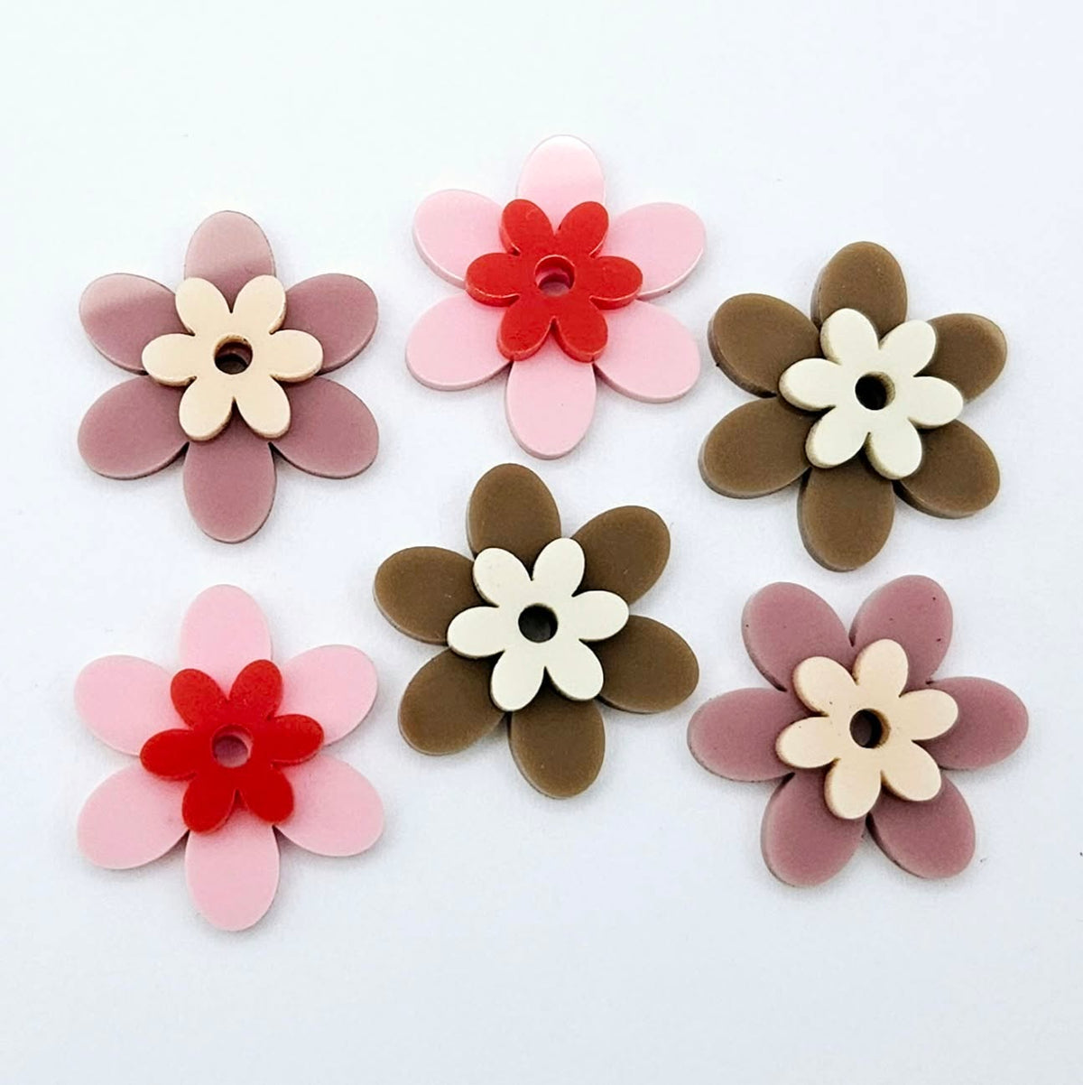 Two-piece solid acrylic flower earring blanks in Pastel Pink and Red, Dusty Rose and Peach, and Iced Coffee and Cream, laid flat together and designed for 20mm hoop earrings.