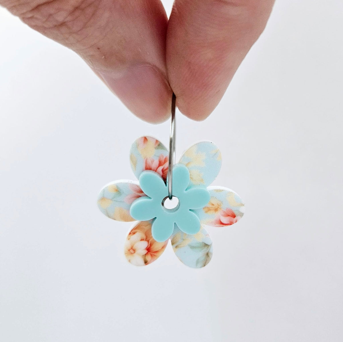 Two-piece Floral Bloom and Pastel Aqua UV printed acrylic flower earring blanks assembled on 20mm stainless steel hoops, showing how the floral pieces combine to create lightweight statement earrings.