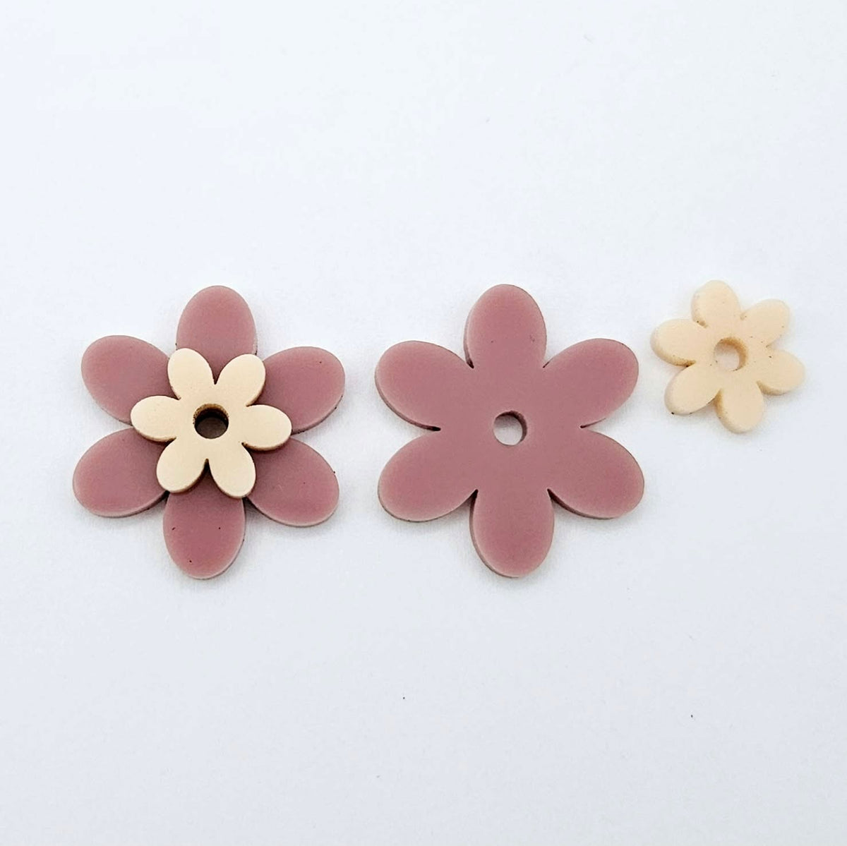 Two-piece solid acrylic flower earring blanks in Dusty Rose and Peach, laid flat and designed for 20mm stainless steel hoops.