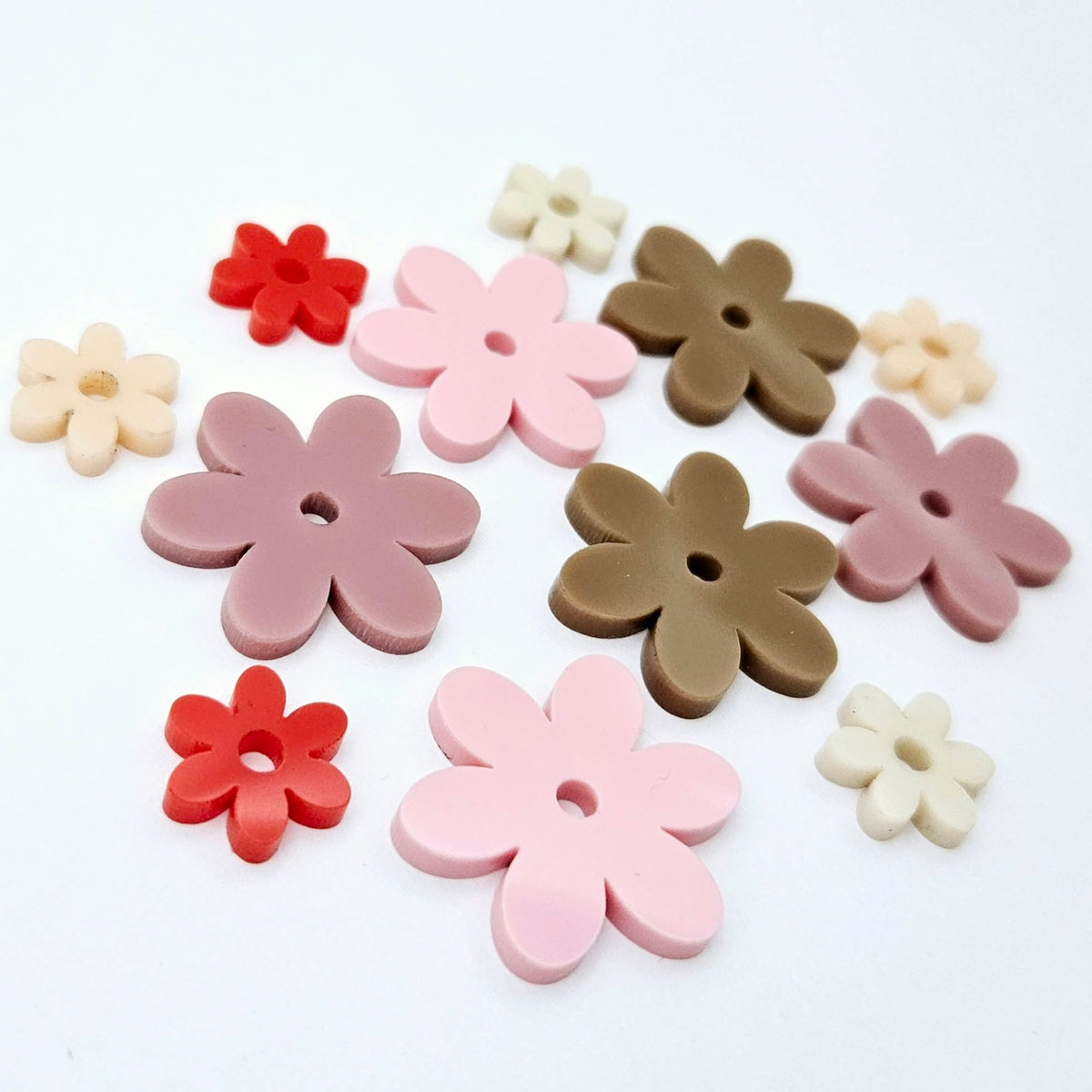 Two-piece solid acrylic flower earring blanks in Pastel Pink and Red, Dusty Rose and Peach, and Iced Coffee and Cream, laid flat together and designed for 20mm hoop earrings.