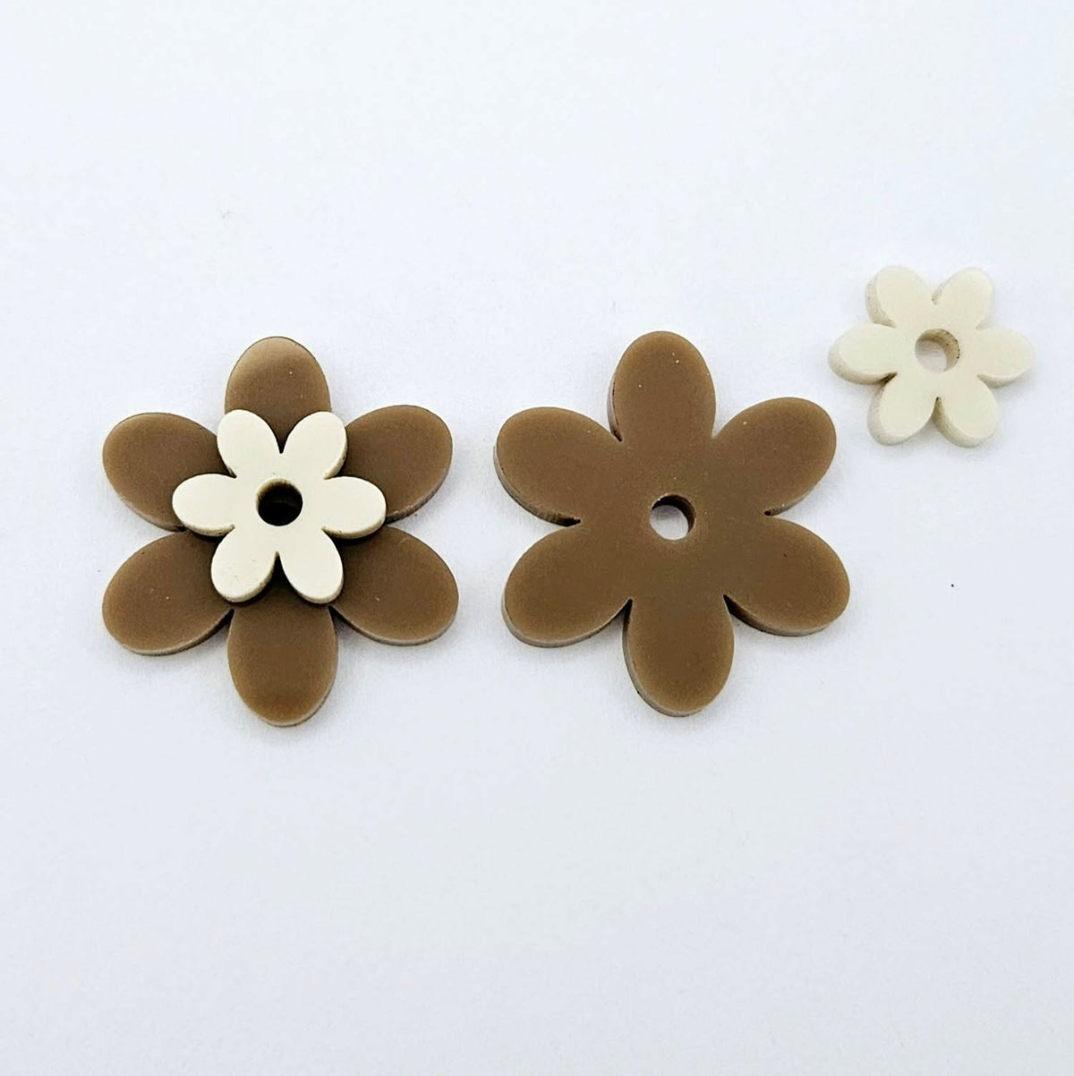 Two-piece solid acrylic flower earring blanks in Iced Coffee and Cream, laid flat and designed for 20mm stainless steel hoops.