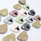 18mm solid acrylic koala stud earring blanks in Grey, Strawberry Milkshake, Dark Grey, Eucalyptus Earth and Dusty Rose, with five paint-filled pairs laid flat and additional unpainted koalas scattered around.